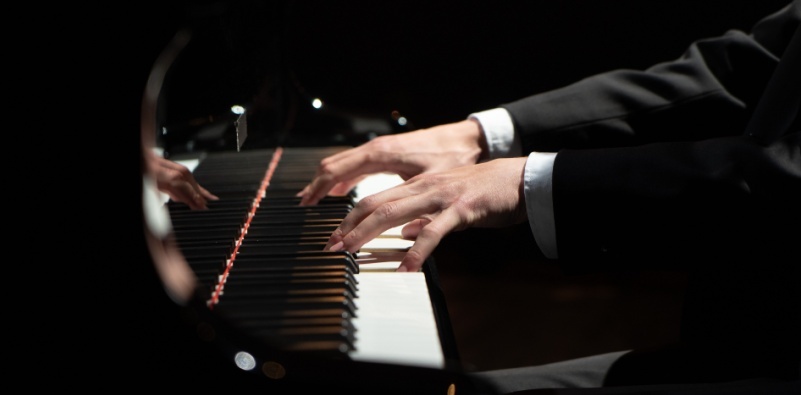 Person playing a piano