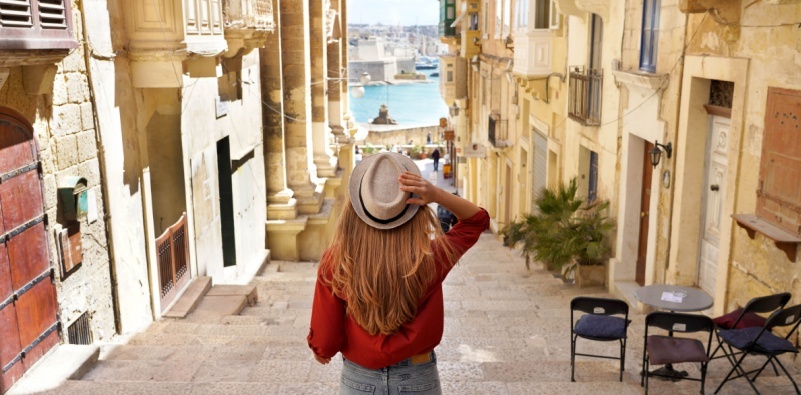 Woman exploring a historic city.