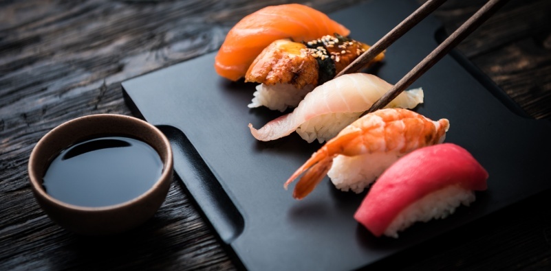 A sushi platter with various pieces of nigiri