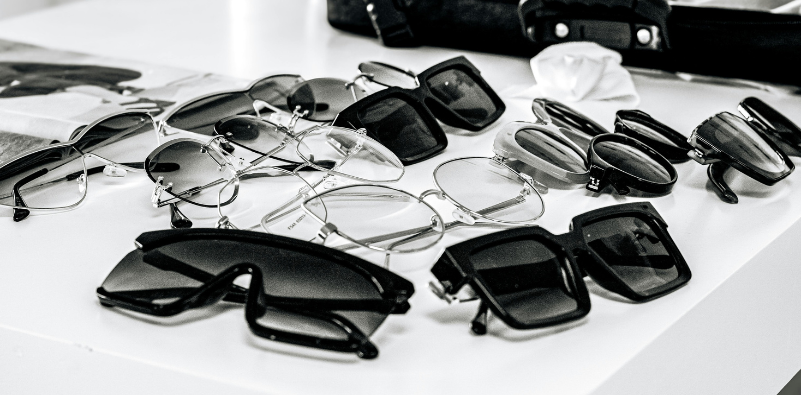 Selection of optical glasses and sunglasses displayed on a table